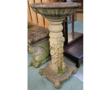 A concrete bird bath, 75cm high Condition Report: Top has a couple of chunks out of the rim, normal signs of wear as per an o