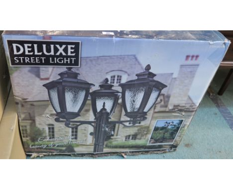 A Deluxe street light (still in box) Condition Report: Brand new in unopened box.