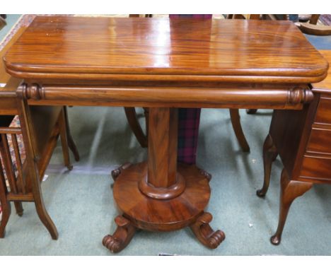 A Victorian mahogany fold over tea table on a pedestal base with four scroll feet, 74cm high x 89cm wide x 44cm deep Conditio