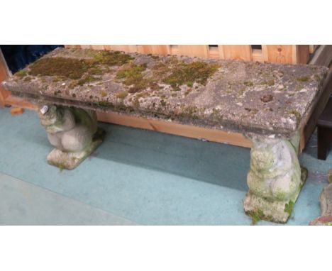 A concrete bench with Squirrel supports, 42cm high x 114cm wide x 32cm deep Condition Report: Normal signs of wear for an out