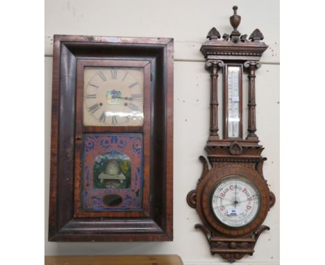 An American walnut wall clock and a carved oak barometer (def) Condition Report: Available upon request