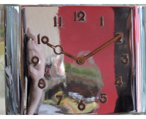 An Art Deco chrome and brass mantel clock, with Arabic numerals, W. 12cm.