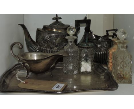 A quantity of plated ware, including a part tea service, two galleried trays and a cruet set. (qty)