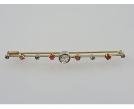 A ruby and diamond knife bar brooch, with an arrangement of eight old cut diamonds and rubies about a central white stone, 4g