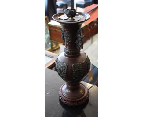 A Chinese bronze vase as a table lamp, of baluster form with panels depicting birds in a landscape, H. 42cm.