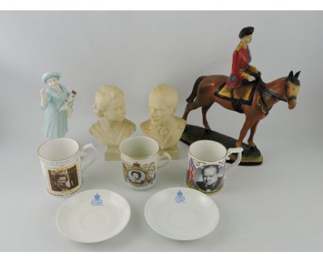 A collection of ceramic Royal ephemera, including busts of the current Queen and Prince Philip, a figure of the Queen at Troo
