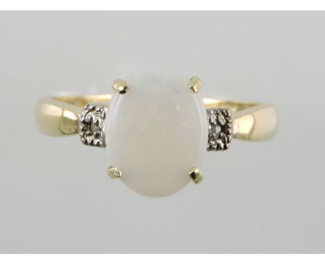 An opal and diamond dress ring, set on a yellow metal band stamped 375, 1g.