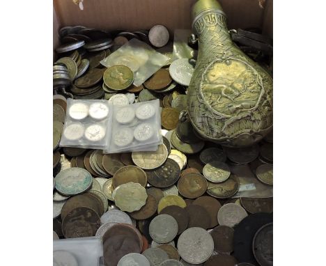 A quantity of English, commonwealth and world coinage Victorian to 1970s including florins and crowns together with an emboss