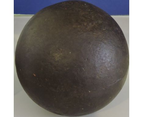 A 17th Century French iron cannonball together with a Victorian miner's lamp.