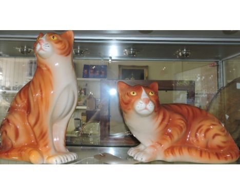 A pair of modern ceramic models of ginger cats.