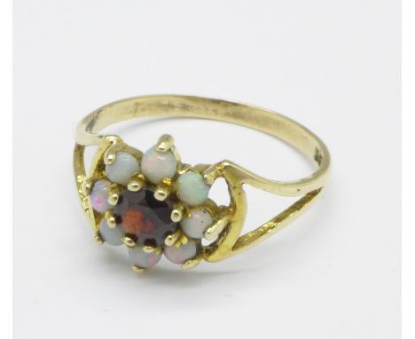 A 9ct gold, garnet and opal ring, 1.6g, M
