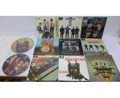 Eleven The Beatles 7" vinyl singles including two picture discs, includes The Beatles' Million Sellers with mis-print on reco