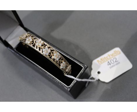 9 ct gold bangle set with opals, gross weight 19.7 grams 
