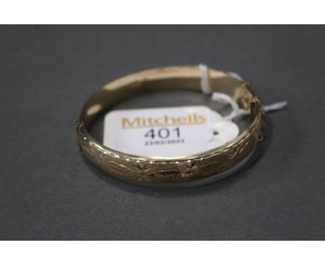 9 ct gold bangle, weight 12.4 grams 