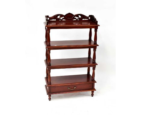 A reproduction four-tier whatnot with pierced three-quarter gallery top, with turned uprights, single base drawer and turned 