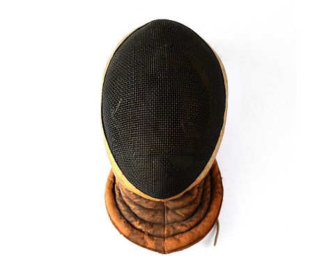 WILKINSON SWORD; a WWI period fencing mask with tan leather surround inscribed with the maker's details and further inscribed