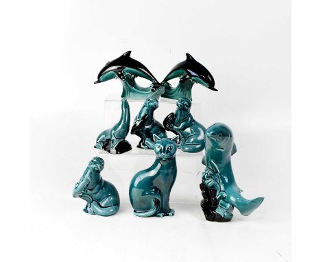 POOLE POTTERY; eight models of animals in blue and black colourway, comprising cat, sea lion, fish, two dolphins and three ot