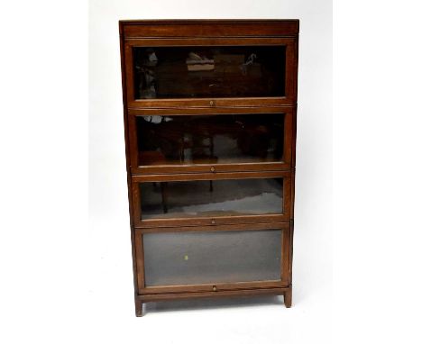 An early 20th century oak four-section stackable bookcase with four lift-up and over glazed doors.Condition Report: 156 x 86 