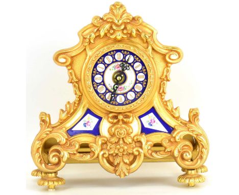 A modern French-style mantel clock of architectural design, gilt metal with blue white and floral enamelled dial and detail, 