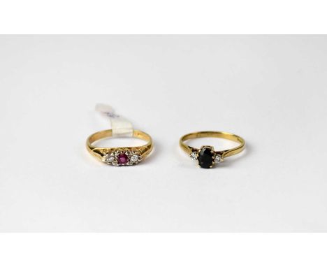 Two 9ct gold rings, one set with ruby and a pair of diamonds, stamped 375, size L1/2, the other set with sapphire and pair of