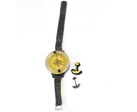 A German WWII Luftwaffe pilot's wrist compass, AK39 model liquid filled, serial no. FL 23235-1, diameter 6cm, on leather stra