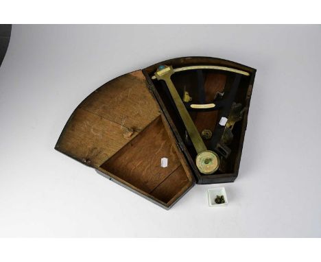 X A 19th century Thompson Yarmouth octant, ebony body, coloured glass, brass fittings and ivory cards, length 34cm, in shaped