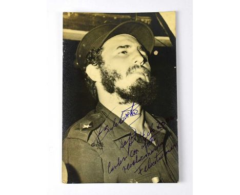 FIDEL CASTRO; a black and white photograph bearing his signature, 15 x 10cm.Condition Report: We have not authenticated this 