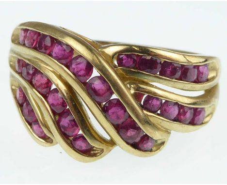 A contemporary 9ct gold and ruby ring with three crossover channels, each set with tiny square rubies, size Q, approx. 4.3g.