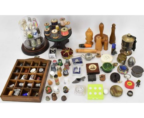 A collection of modern, vintage and antique sewing equipment to include tape measures, bobbin holder, darning tools, pin cush