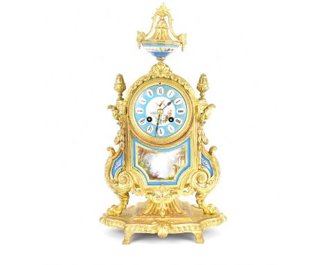 An early 20th century French-style gilt metal mantel clock, the porcelain dial set with Roman numerals, central floral decora