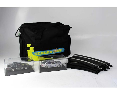 SCALEXTRIC; a small quantity of track contained within a Scalextric bag, also containing two cased Vauxhall Vectra Touring Ca