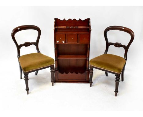 A pair of balloon back chairs with stuff-over seats and reeded front supports, and a reproduction mahogany wall-hanging shelf