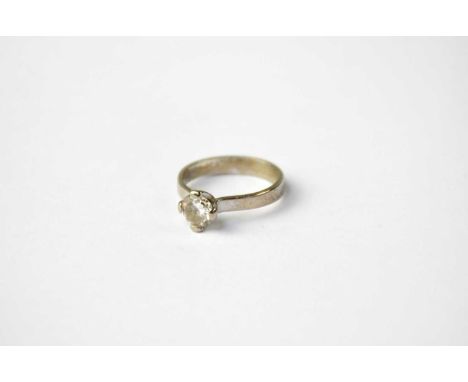 An 18ct white gold solitaire diamond ring in contemporary setting, approx. 0.6ct, stamped 750, size M, approx. 3.6g.Condition