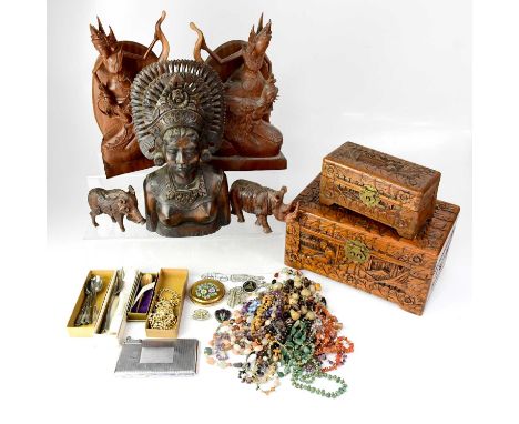 A group of Indonesian carved figures to include female figures, decorative jewellery box, warthog, Hippo and a heavily carved