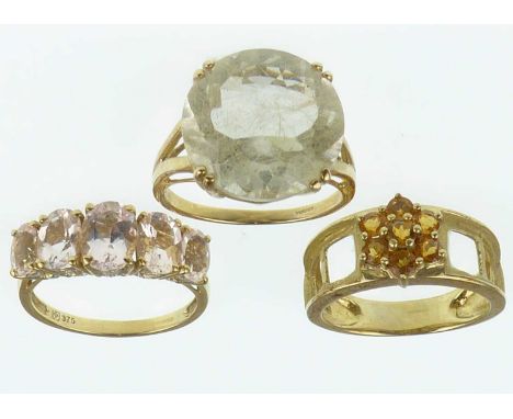 Three 9ct gold dress rings, one with large cut white stone, size P, one with five graduated claw set light pink/lilac stones,