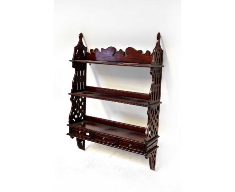 A reproduction mahogany wall shelf with pierced side supports and three base drawers, 92 x 66 x 19cm.Condition Report: The ga