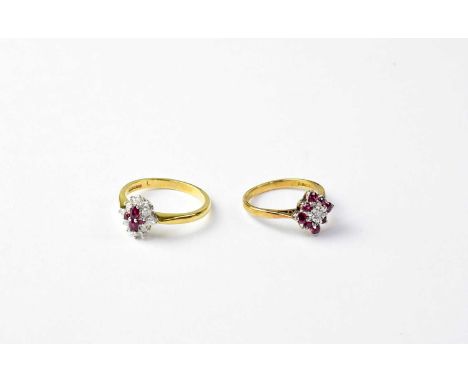 Two 18ct gold ruby and diamond cluster rings, stamped 18, size K1/2, and 750, size P, combined approx. 7.1g (2).Condition Rep