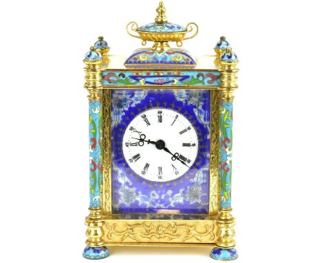 A modern Chinese-style champlevé enamel and brass mantel clock, the white enamelled dial set with Roman numerals, Arabic five
