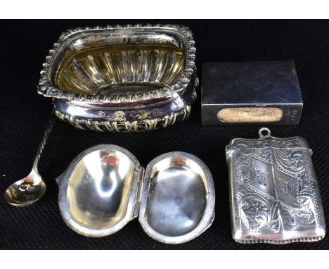 Five small silver items comprising a salt pot and small silver spoon, a small vesta case with floral pattern, central vertica