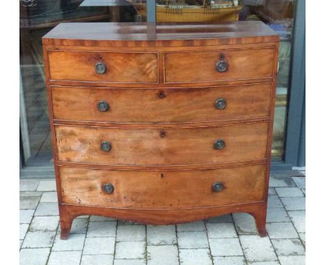 A Georgian crossbanded mahogany bow front chest of two short over three long drawers to outswept bracket feet, 106 x 107 x 52