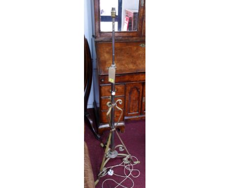 A 20th century standard lamp, on tri-form scrolling base, H.150cm, with loose shade 