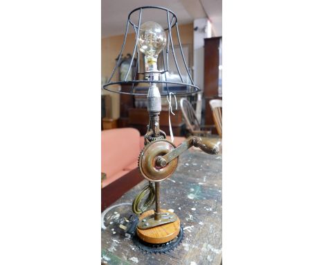 A table lamp constructed from old manual drill parts, H.62cm 