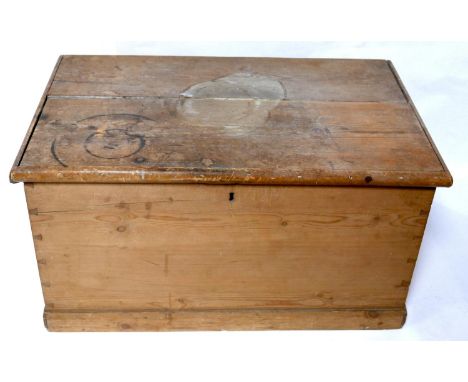 An early 20th century pine trunk with fitted candle box and drawer, H.45 W.84 D.51cm 