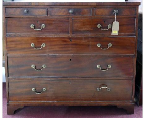 A Georgian mahogany chest with five short over three long drawers, raised on bracket feet, H.106 W.122 D.53cm 