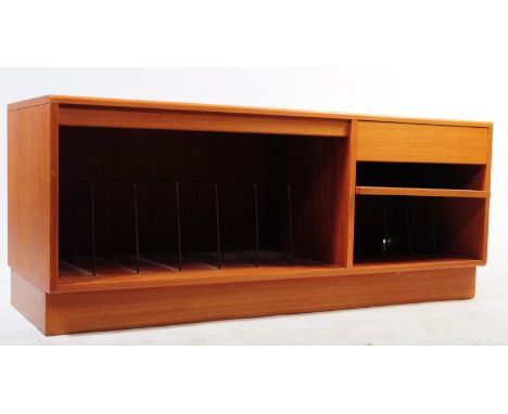 British Modern Design - A mid 20th century teak wood low music cabinet sideboard unit. The sideboard raised on a plinth base 