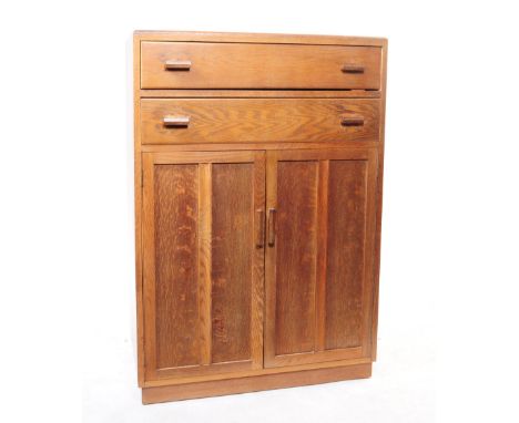 A vintage 20th century Art Deco oak cabinet / cupboard. Rectangular form with bank of two full length drawers over twin cabin