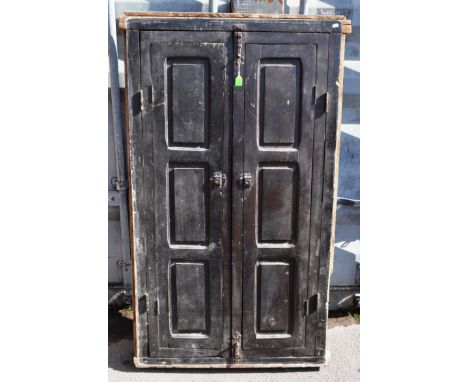 A vintage 20th century Moroccan heavy duty window door. Large rectangular form with ebonised twin doors. Opening to reveal gl