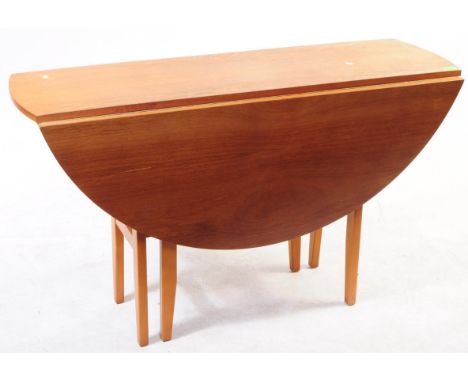 British Modern Design - A mid century teak veneer space saver dining table. Drop leaf extension, with upright gate leg suppor