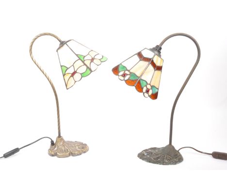 Two contemporary Tiffany style desk top table lamp lights. Having typical stained glass design with lead sections, floral pat