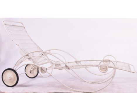A vintage 20th century white painted garden lounger / patio chair. Having folding capabilities wire work seat and back rest w